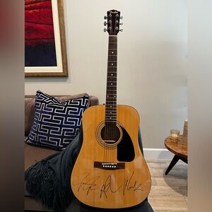 Signed guitar by all three Jonas brothers